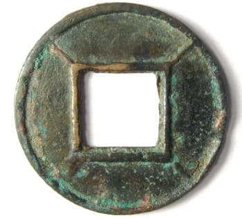 Wu zhu coin with
          lines radiating from corners of hole