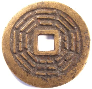 Large Chinese charm displaying
              bagua (eight trigrams)