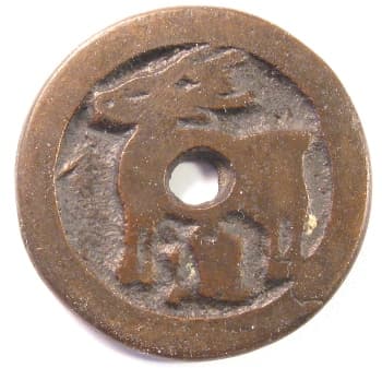 Reverse side of
        charm or game piece displaying a deer and a Chinese character