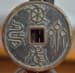 Chinese charms written in
          bird-worm seal script