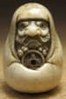 Bodhidharma holding a wu zhu
coin