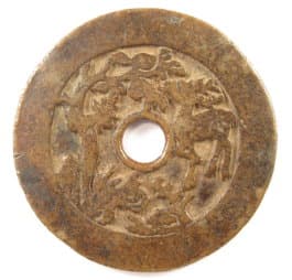 Reverse side of old Chinese charm showing deer, bat and other symbols