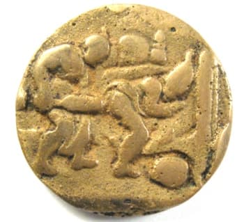 Chinese erotic
            coin or charm showing a man and woman engaged in sexual
            activity