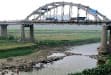 Villagers dig for coins in
Grand Canal