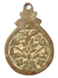 Reverse side
              of loop charm showing tree and two birds
