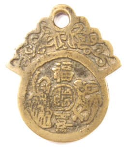 Reverse side
              of old loop charm with three characters and a deer and
              immortal