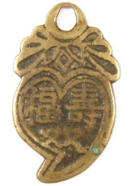 Chinese peach charm
      with inscription longevity, good fortune, wealth and rank