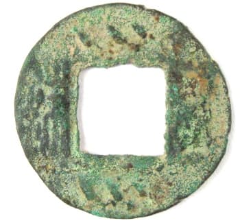 Wu zhu coin with
          three slanted lines above and three slanted lines below the
          square hole