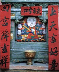 Zaojun, the "Kitchen God" or "Stove
            God", displayed in a home altar
